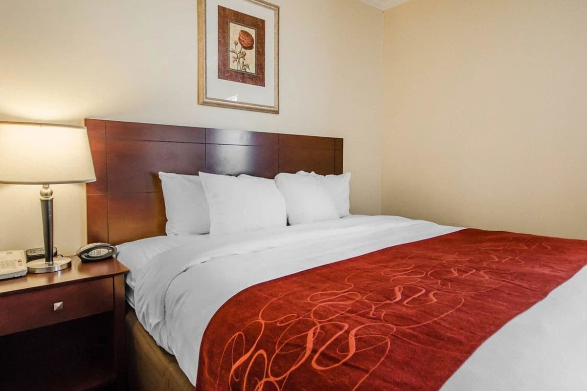 Premium bedding, desk, laptop workspace, iron/ironing board