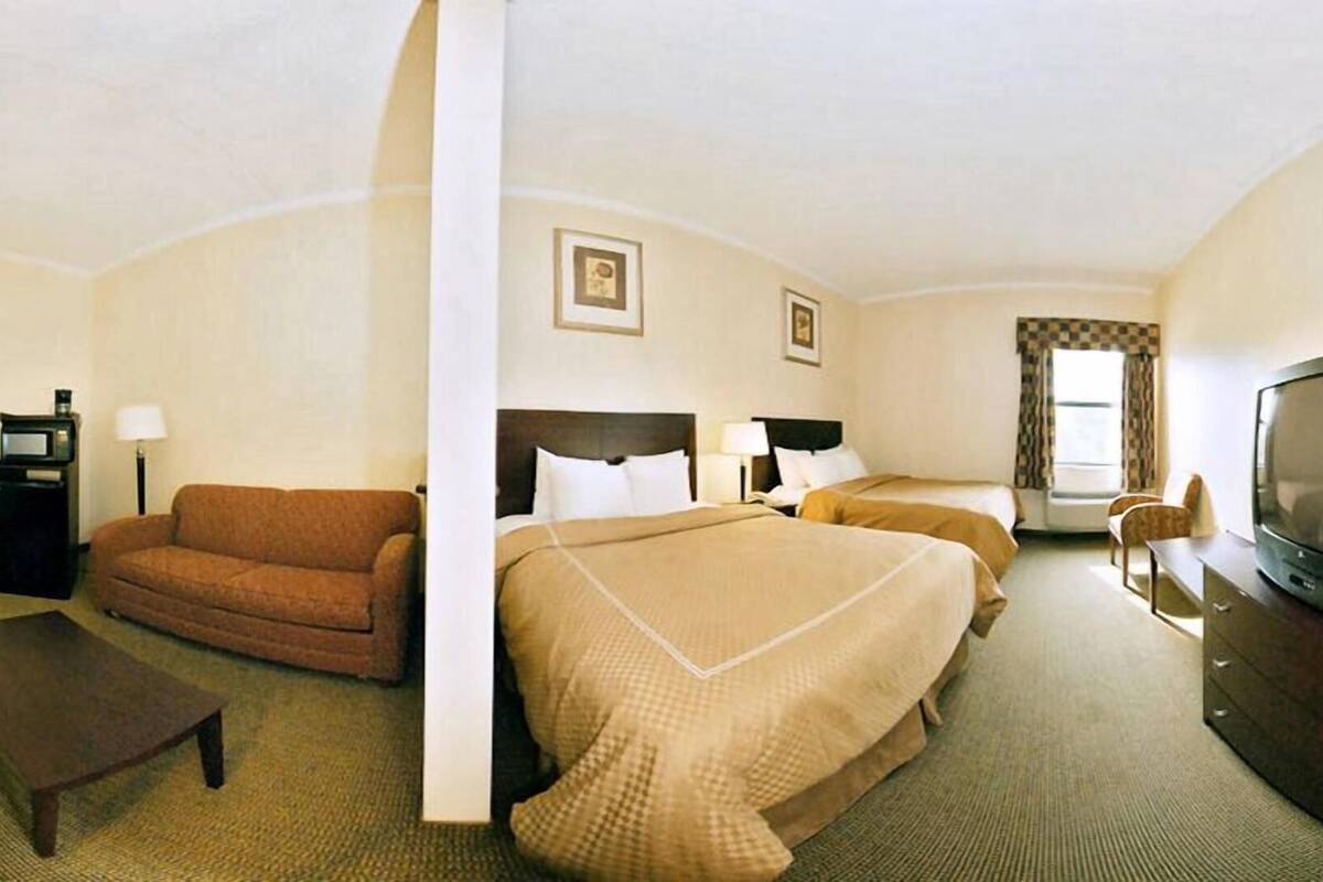 Premium bedding, desk, laptop workspace, iron/ironing board