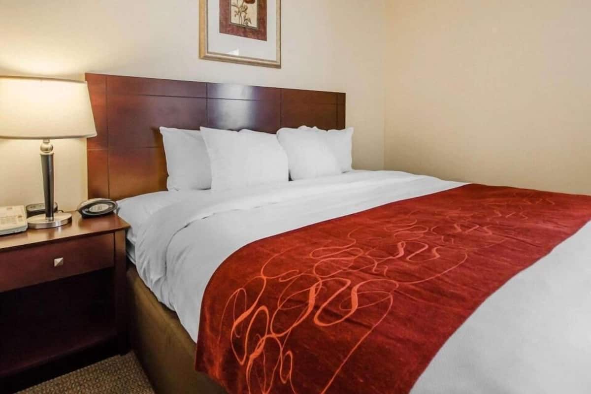 Premium bedding, desk, laptop workspace, iron/ironing board