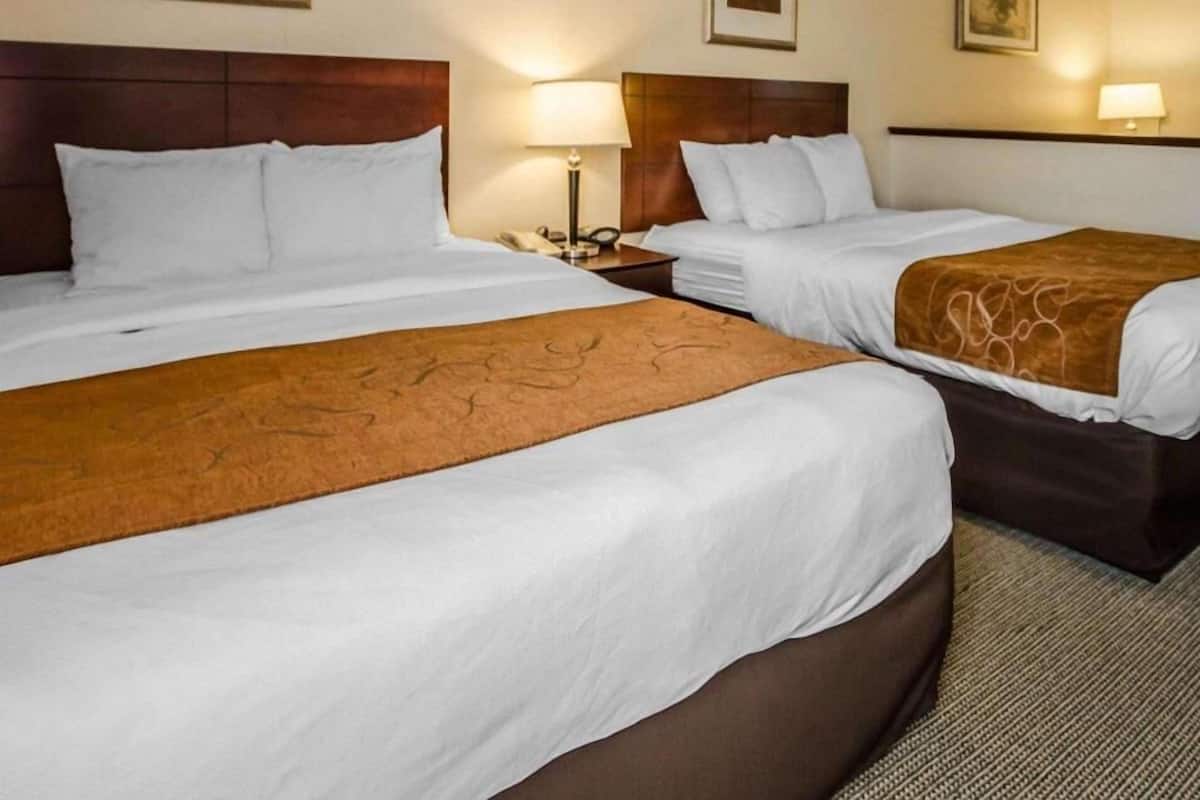 Premium bedding, desk, laptop workspace, iron/ironing board