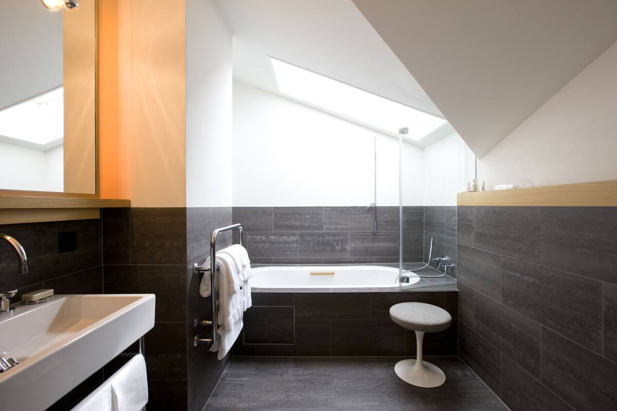 deluxe double room, 1 king bed | bathroom | hair dryer, bathrobes, slippers, towels