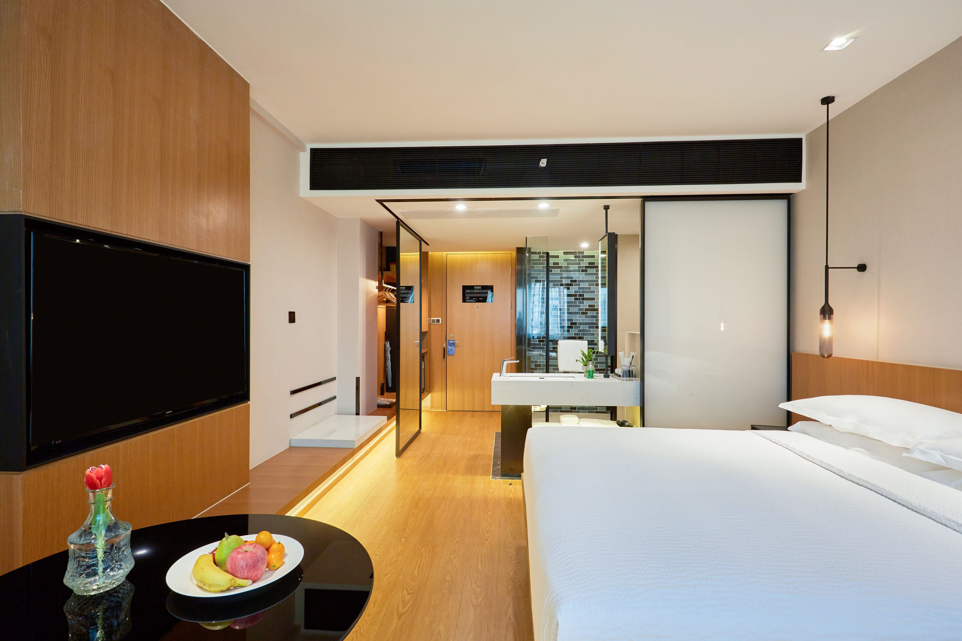 deluxe room, 1 king bed, city view | in-room safe, desk, laptop workspace, blackout curtains