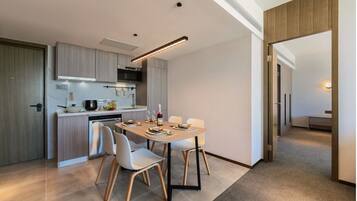 Family Apartment | Living area | 42-inch TV with digital channels, smart speakers