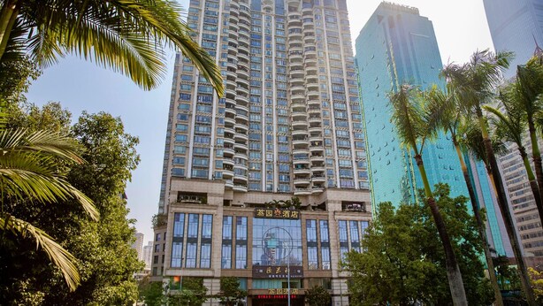 A high-rise building with multiple balconies and a large glass facade. - Shenzhen Liyuan Hotel (Shenzhen)