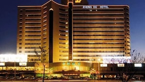 A multi-story hotel with a prominent 'Zhong Du Hotel' sign at the top. - Zhongdu Hotel (Zhengzhou)