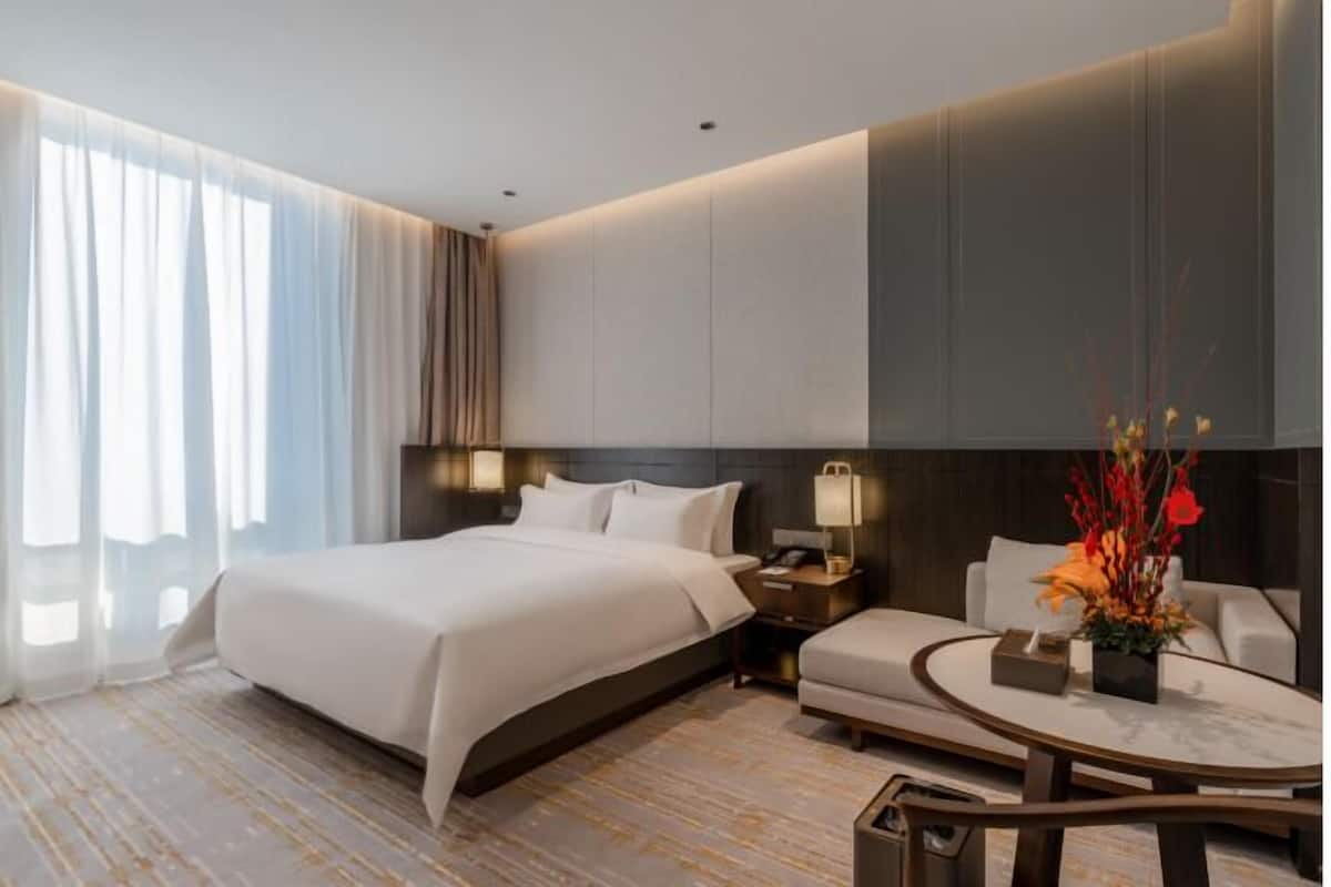 Edredón, cortinas blackout, wifi gratis y ropa de cama