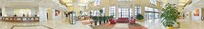 A spacious lobby with a reception desk, seating area, and large windows. - Dalian International Finance Conference Center (Dalian)