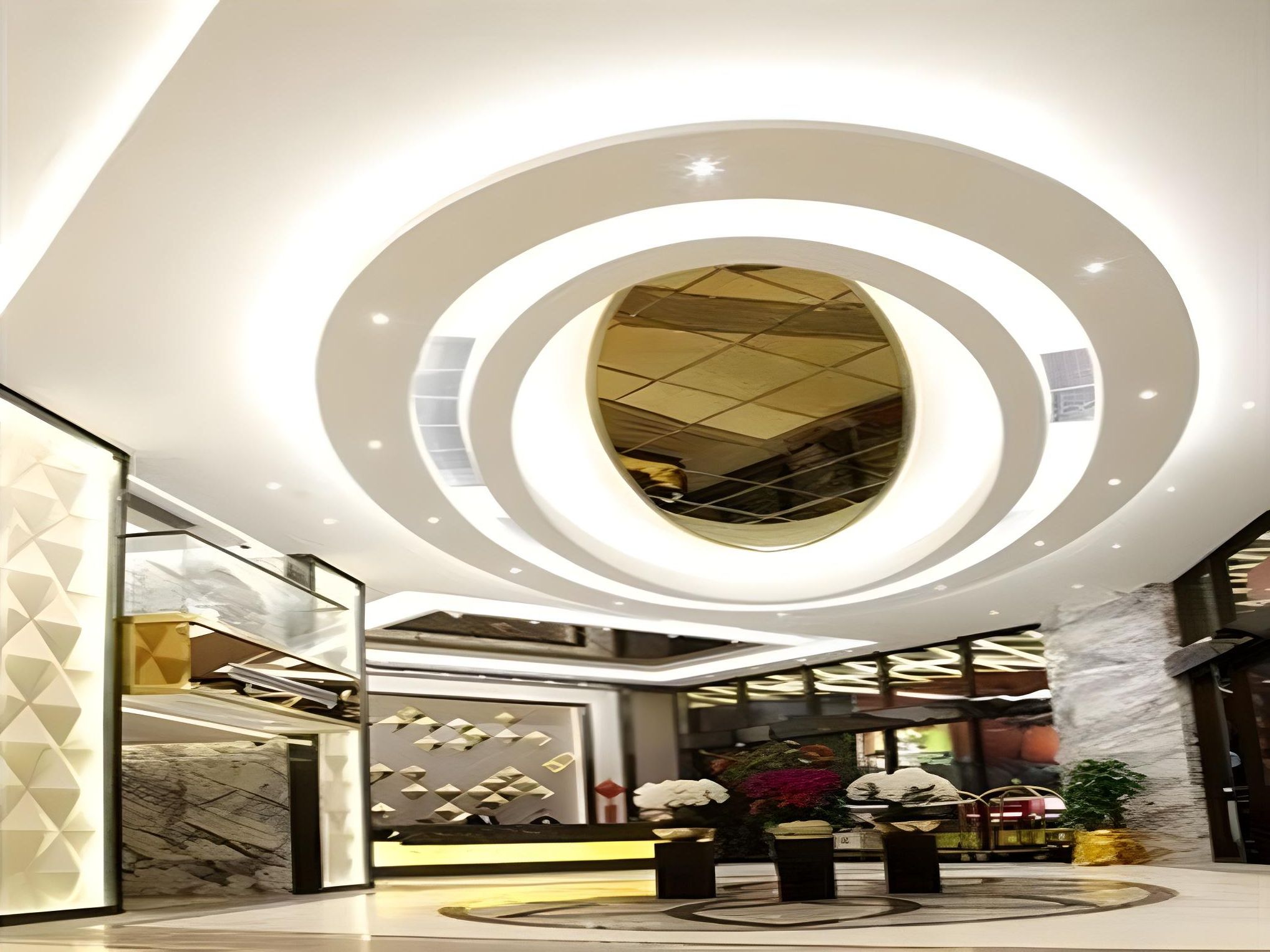 A modern lobby with a circular skylight and a central column.