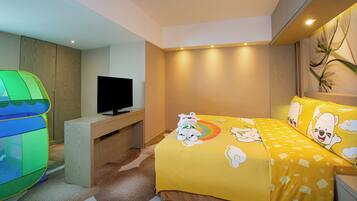 A bedroom with a bed, a television on a stand, a green play tent, and a wall with a plant.