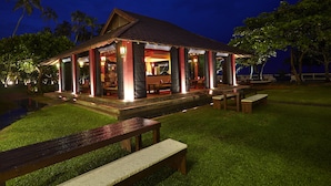 A building with a covered patio area, outdoor seating, and a small pool. - Turyaa Kalutara (Wadduwa)