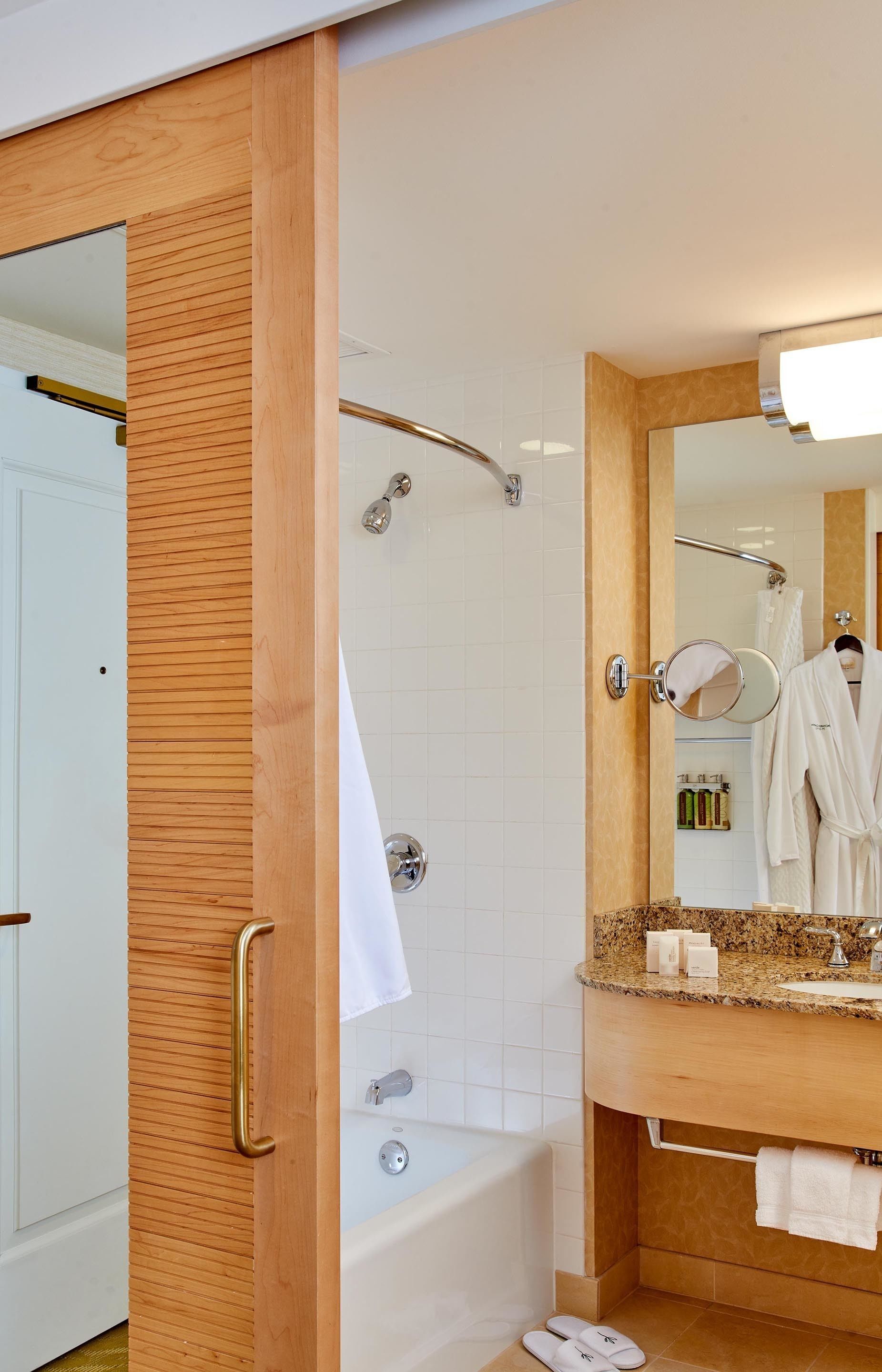 junior suite, 1 king bed | bathroom | combined shower/bathtub, designer toiletries, hair dryer, bathrobes