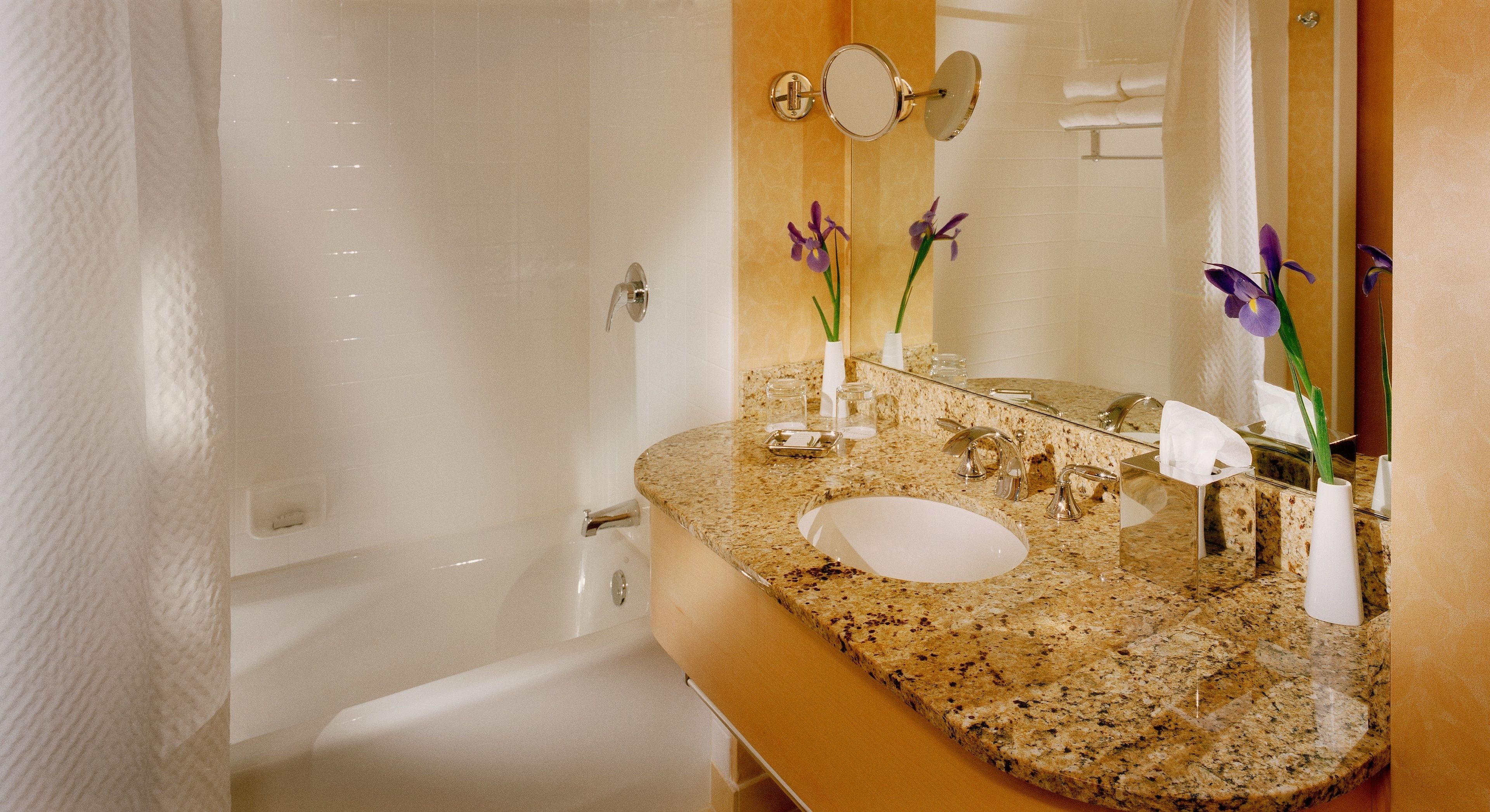 combined shower/bathtub, designer toiletries, hair dryer, bathrobes