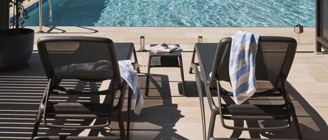 2 outdoor pools, open 7:00 AM to 7:00 PM, pool umbrellas, sun loungers