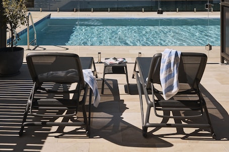 2 outdoor pools, open 7:00 AM to 7:00 PM, pool umbrellas, sun loungers