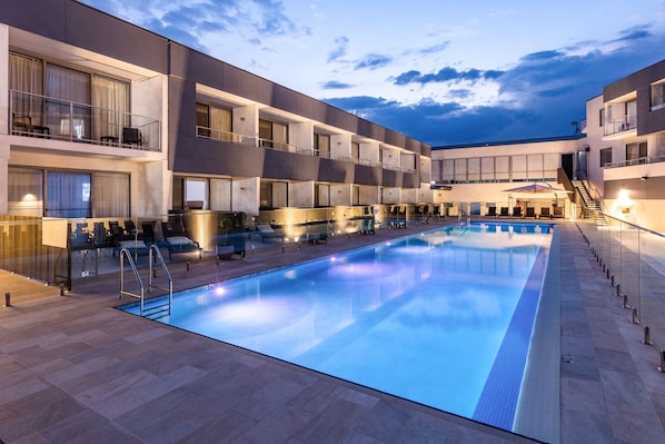 2 outdoor pools, open 7:00 AM to 7:00 PM, pool umbrellas, sun loungers