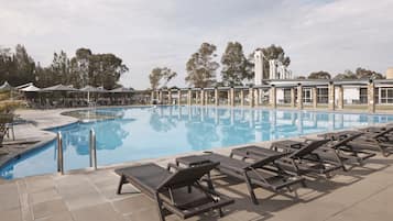 2 outdoor pools, open 7:00 AM to 7:00 PM, pool umbrellas, pool loungers