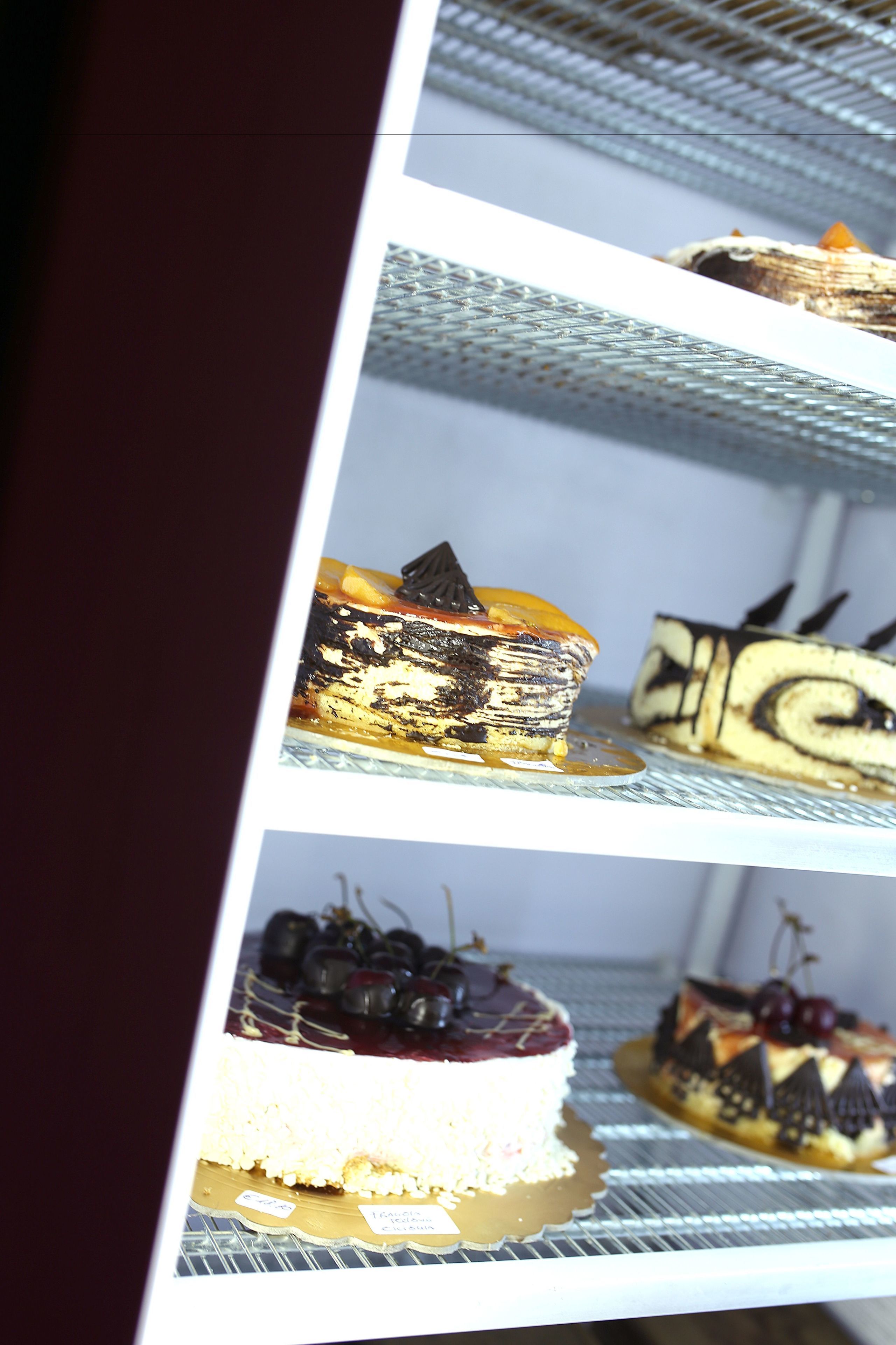 A display case with various desserts.