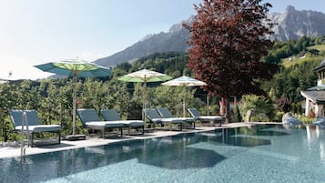 Indoor pool, outdoor pool, pool umbrellas