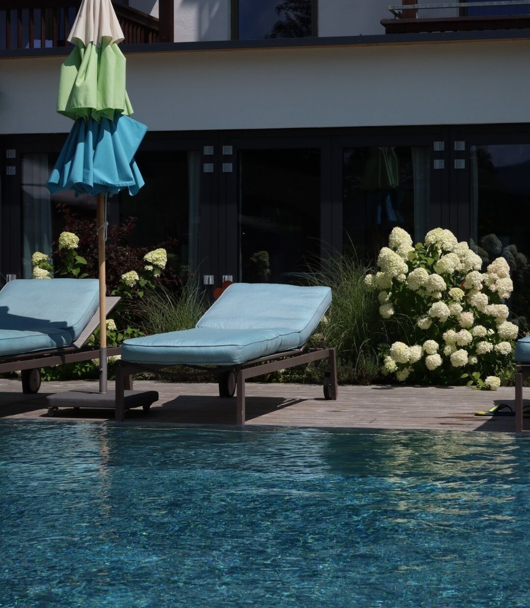 indoor pool, outdoor pool, pool umbrellas