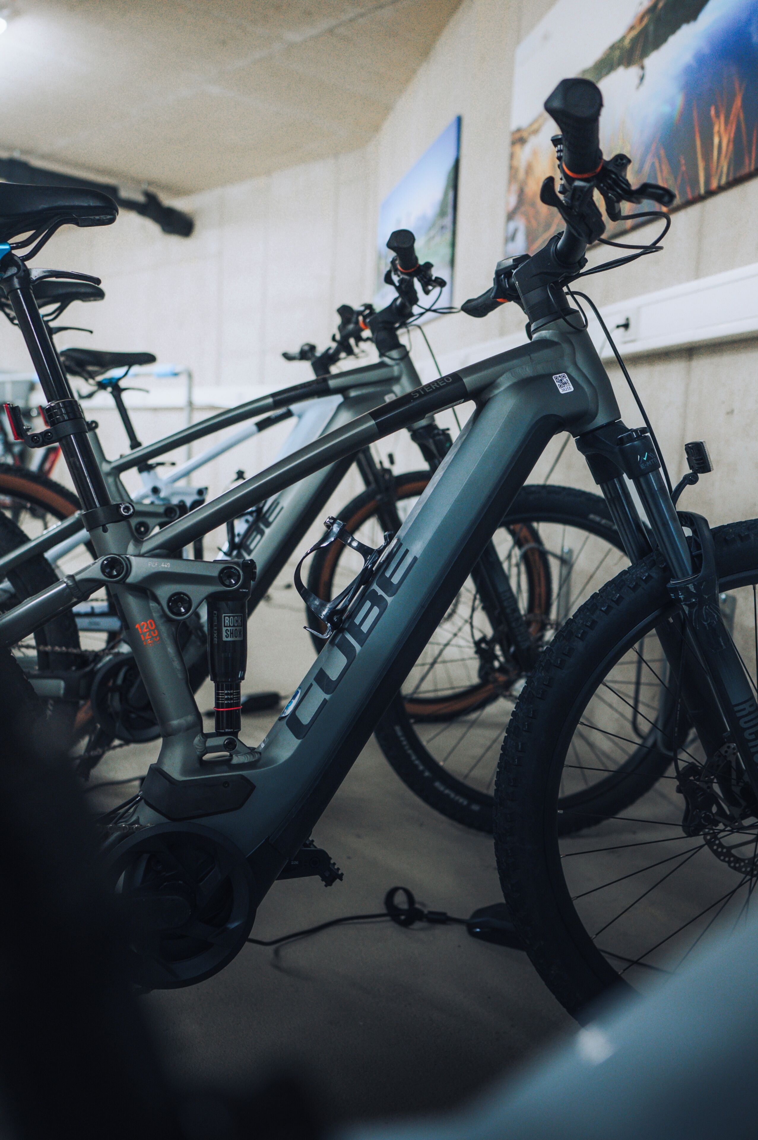 A row of bicycles with a visible brand name and a lock attached to the frame.