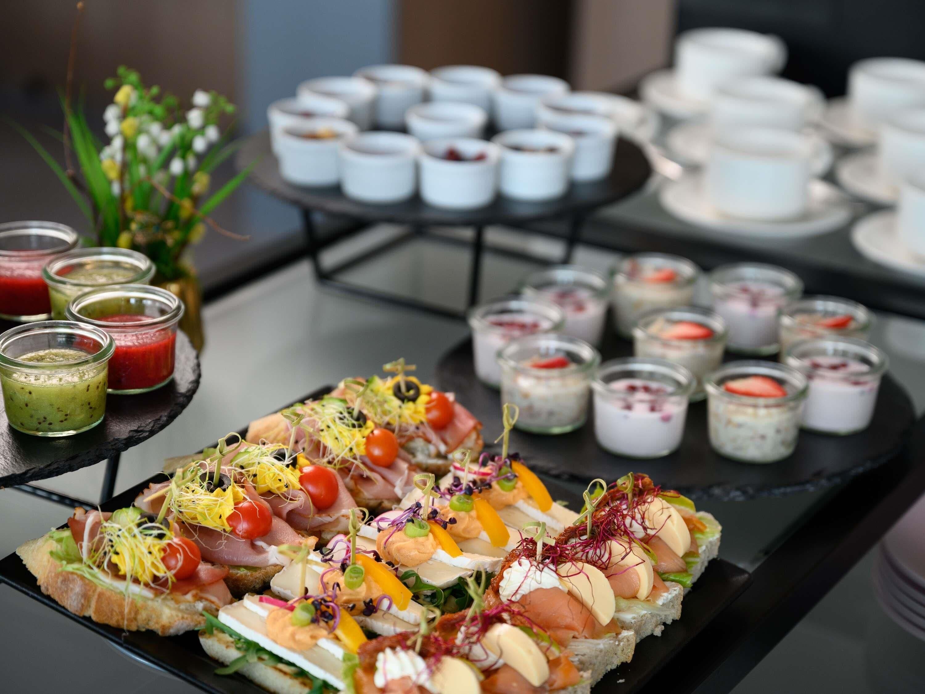 A buffet with various food items and beverages.