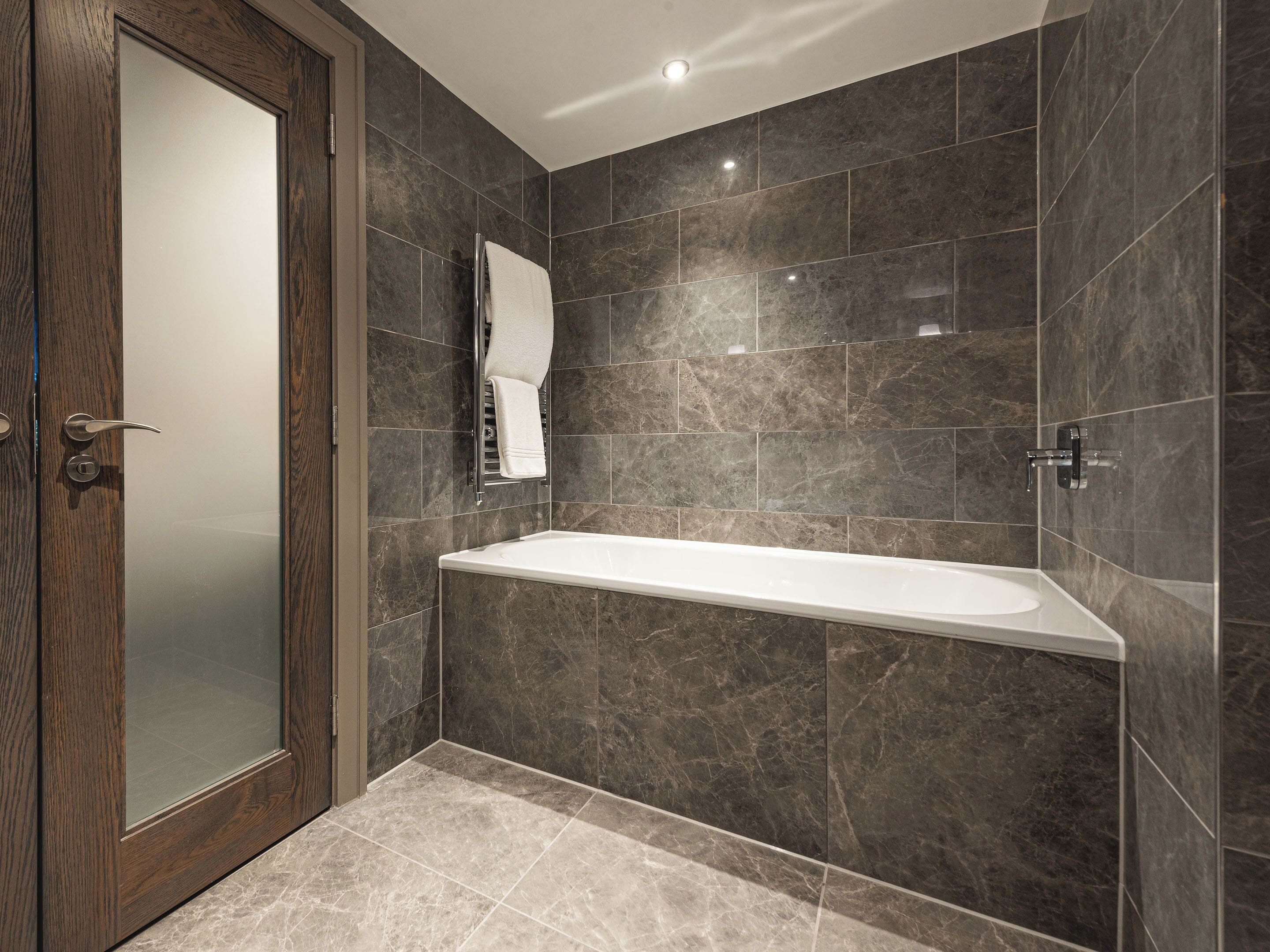 signature suite | bathroom | shower, rainfall showerhead, designer toiletries, hair dryer