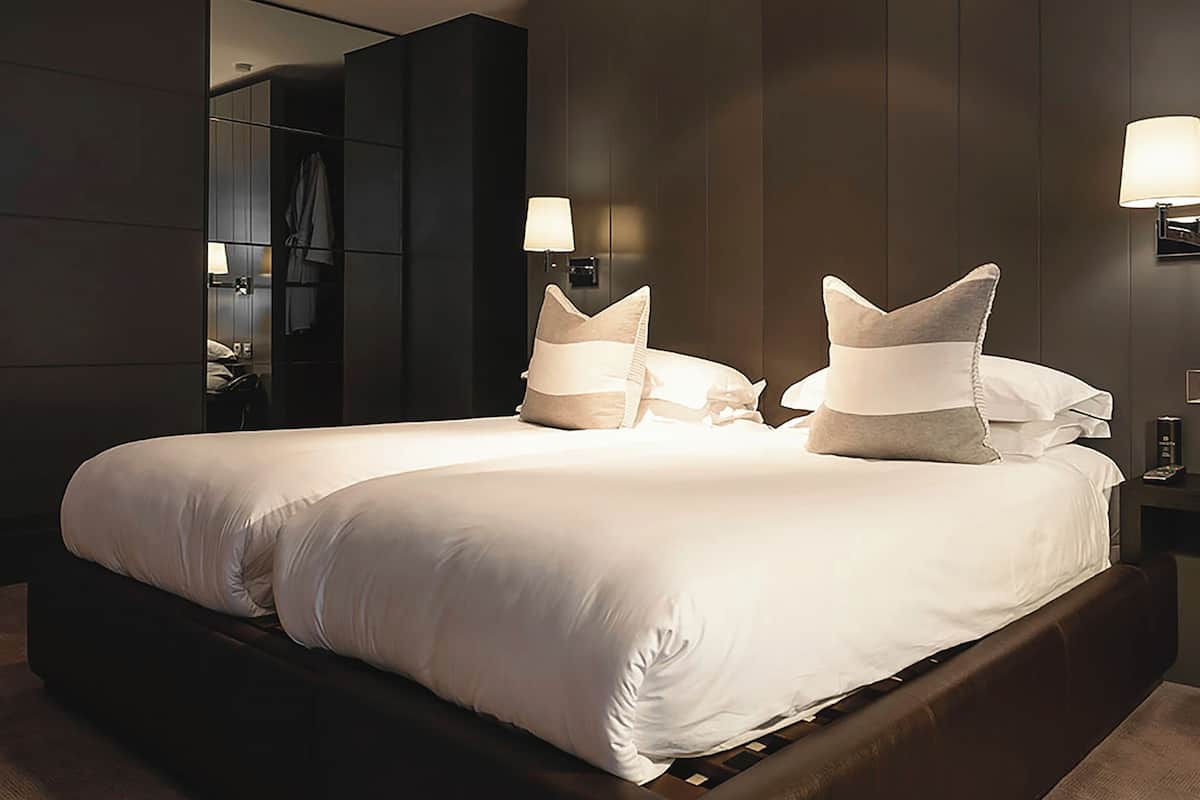 classic twin room (dakota) | premium bedding, desk, laptop workspace, iron/ironing board