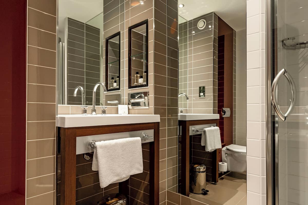 shower, rainfall showerhead, designer toiletries, hair dryer