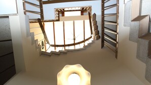 Una escalera de caracol con un aplique circular en la parte inferior.