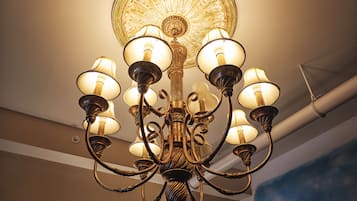 A chandelier with multiple arms and light fixtures.