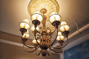 A chandelier with multiple arms and light fixtures.
