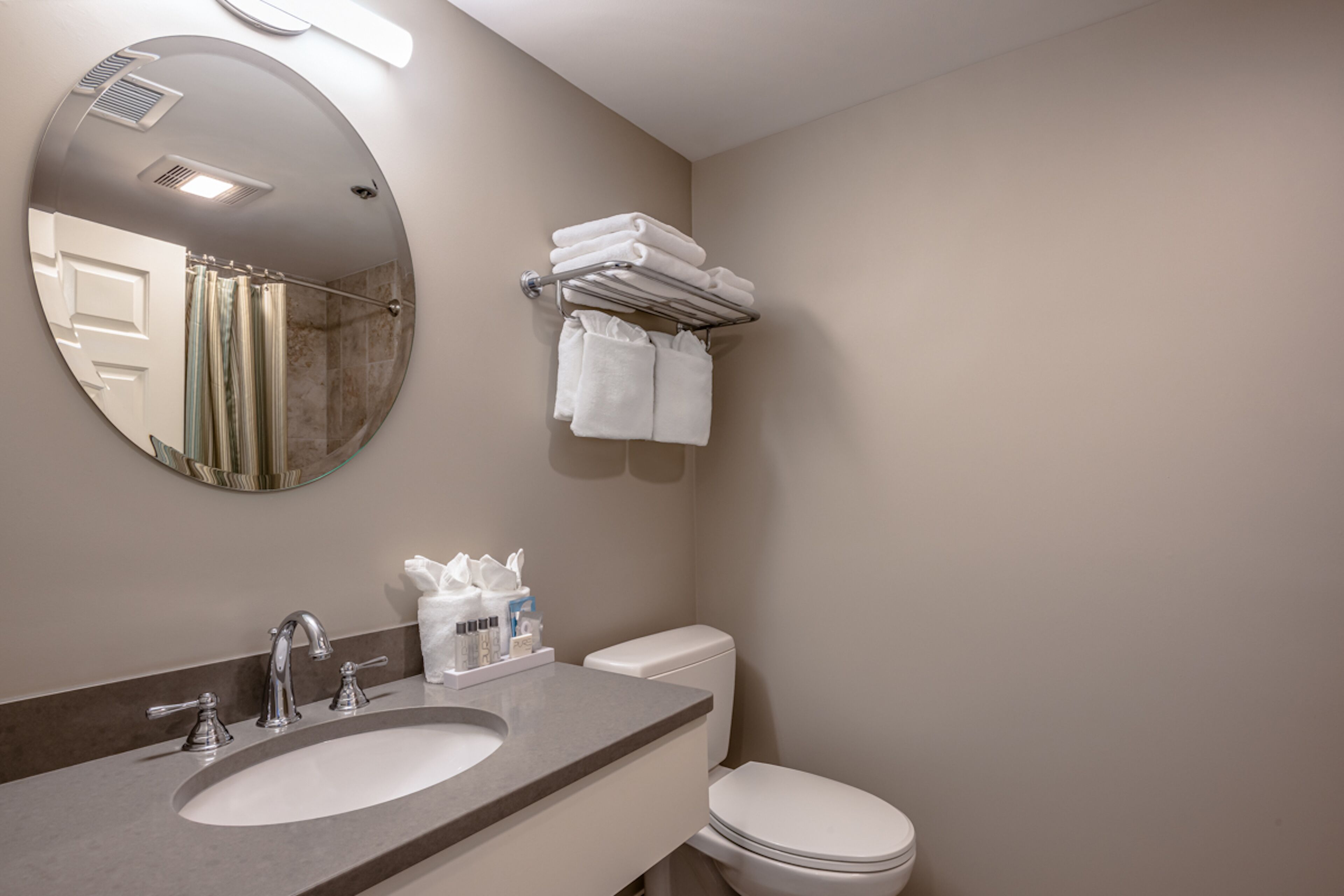 designer toiletries, hair dryer, bathrobes, towels