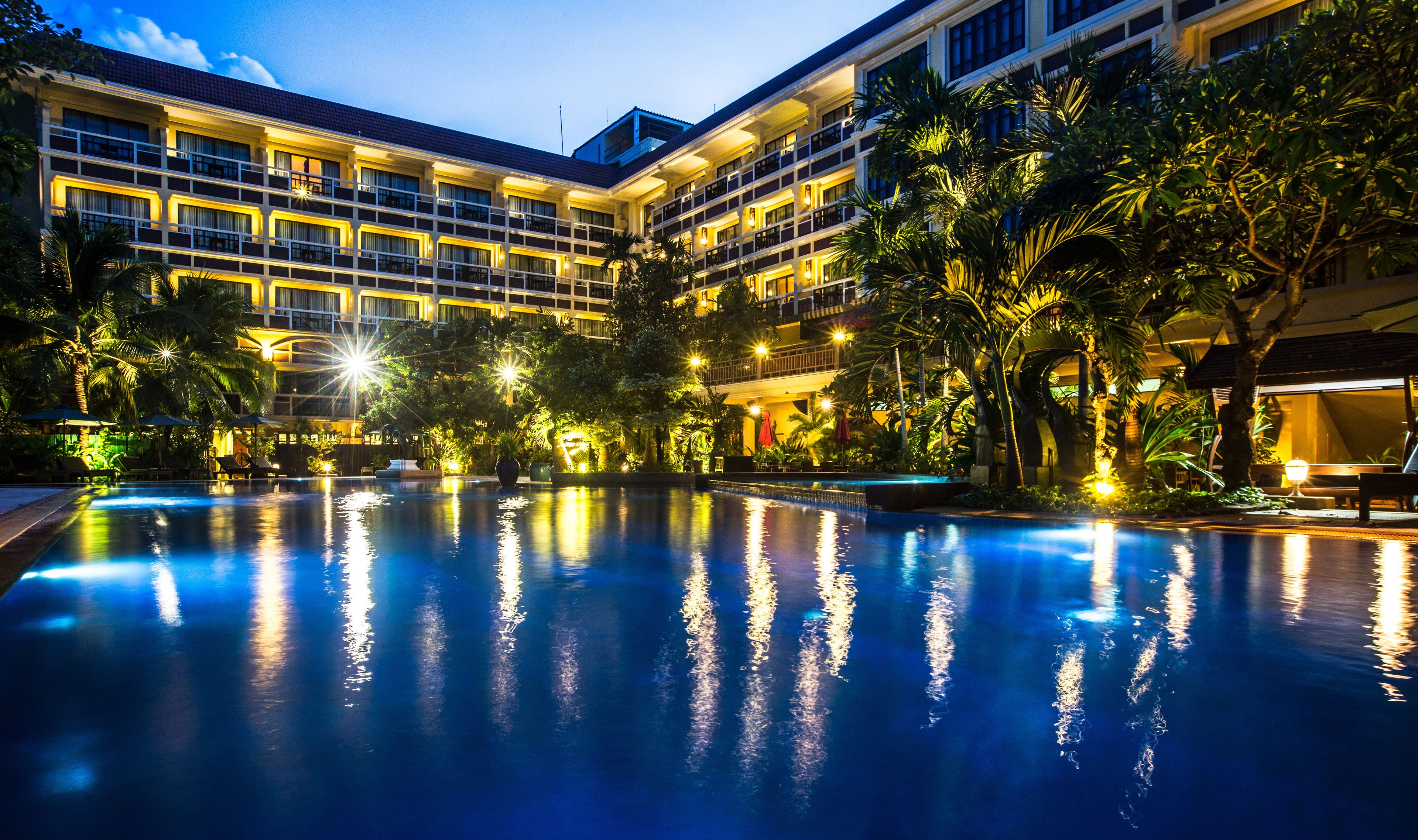 Outdoor pool, open 6:00 AM to 9:00 PM, pool umbrellas