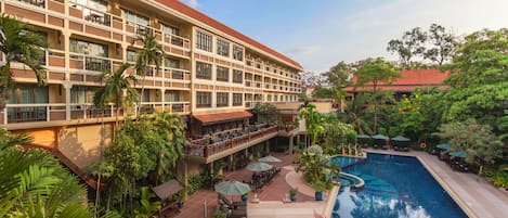 Outdoor pool, open 6:00 AM to 9:00 PM, pool umbrellas