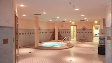 Relax by the pool, surrounded by a geometric patterned floor and decorative tiles.