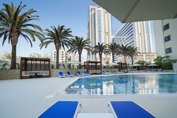 Outdoor pool, open 7:00 AM to 8:00 PM, free cabanas, pool umbrellas