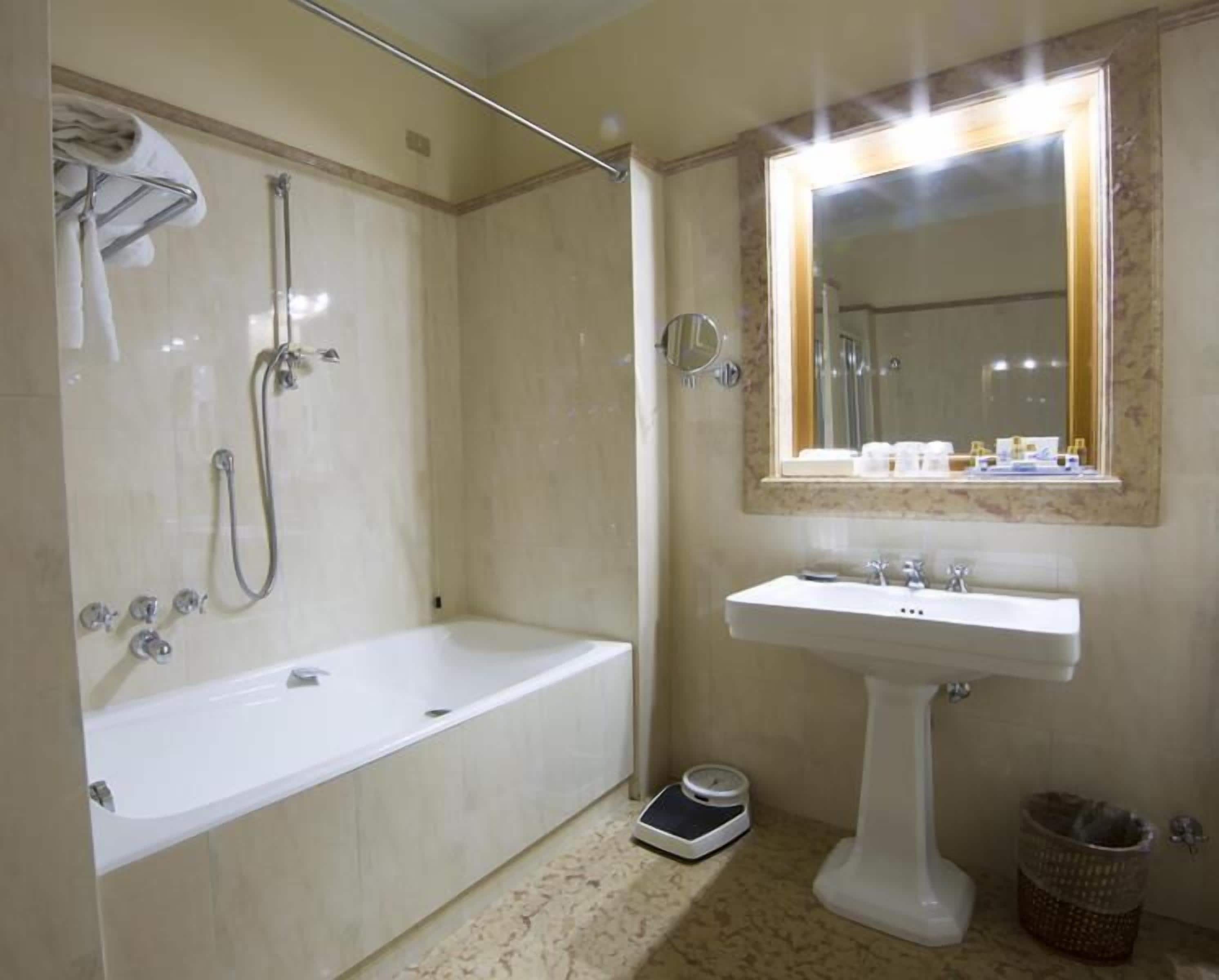 deluxe triple room | bathroom | separate bathtub and shower, free toiletries, hair dryer, bidet