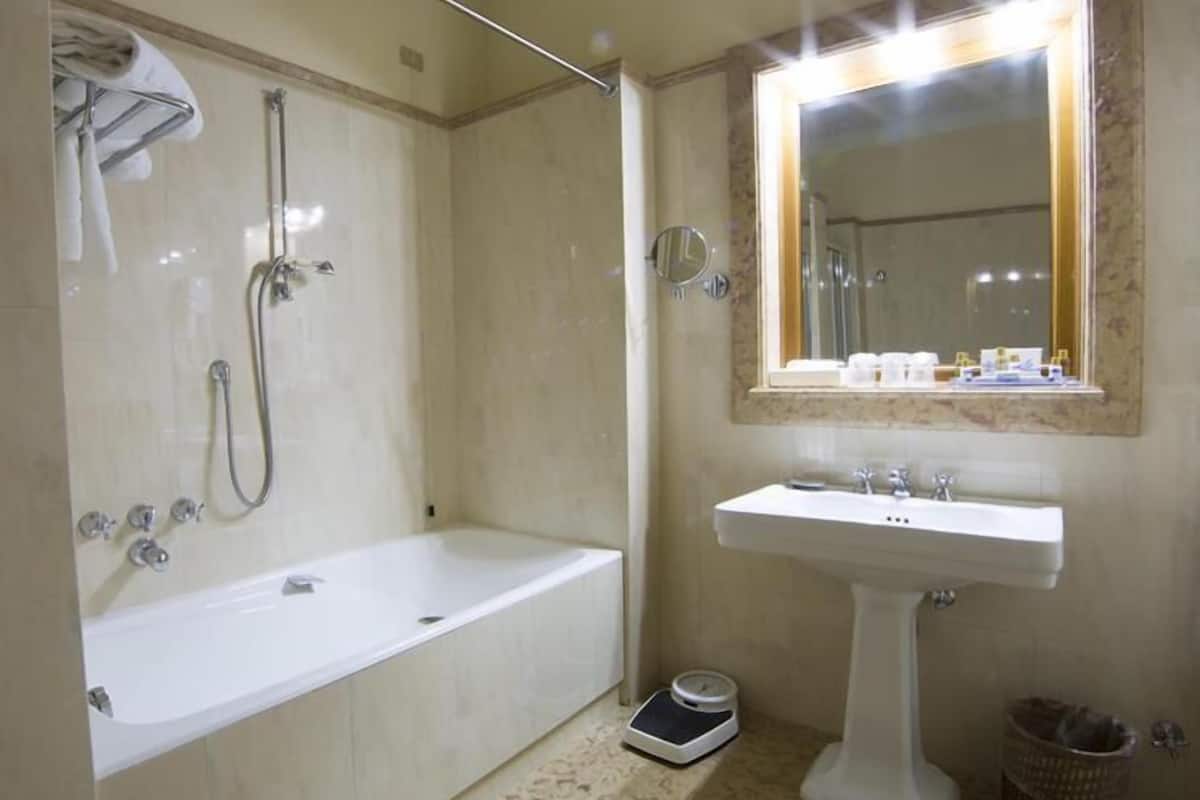 deluxe triple room | bathroom | separate bathtub and shower, free toiletries, hair dryer, bidet