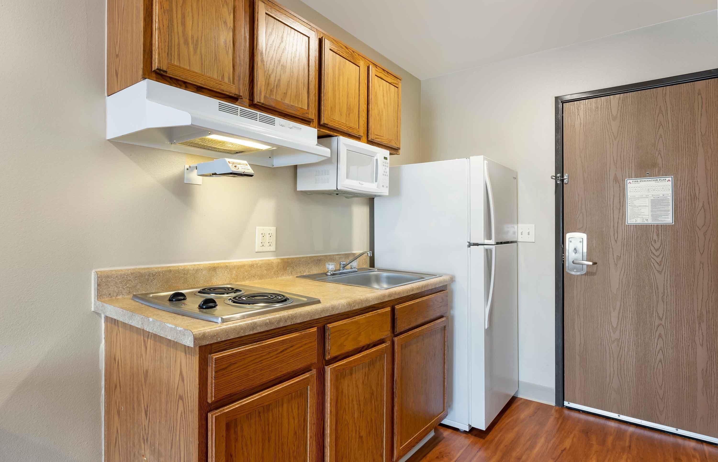 Full-size fridge, microwave, stovetop, freezer