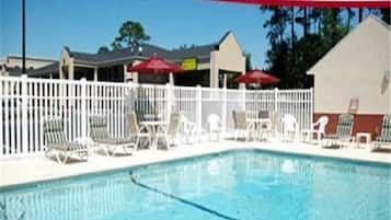 Outdoor pool, open 9:00 AM to 11:00 PM, sun loungers