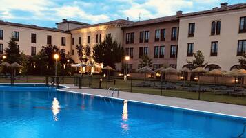 Indoor pool, outdoor pool, pool umbrellas, sun loungers