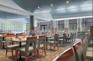 A spacious restaurant with high ceilings and large windows, featuring multiple dining tables and chairs. - Hilton Baltimore BWI Airport (Linthicum Heights)