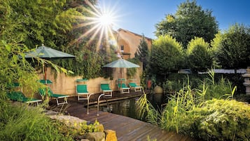 Indoor pool, outdoor pool, open 7 AM to 10 PM, pool umbrellas