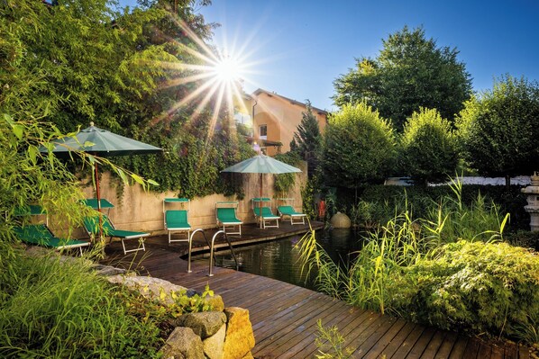 Indoor pool, outdoor pool, open 7 AM to 10 PM, pool umbrellas