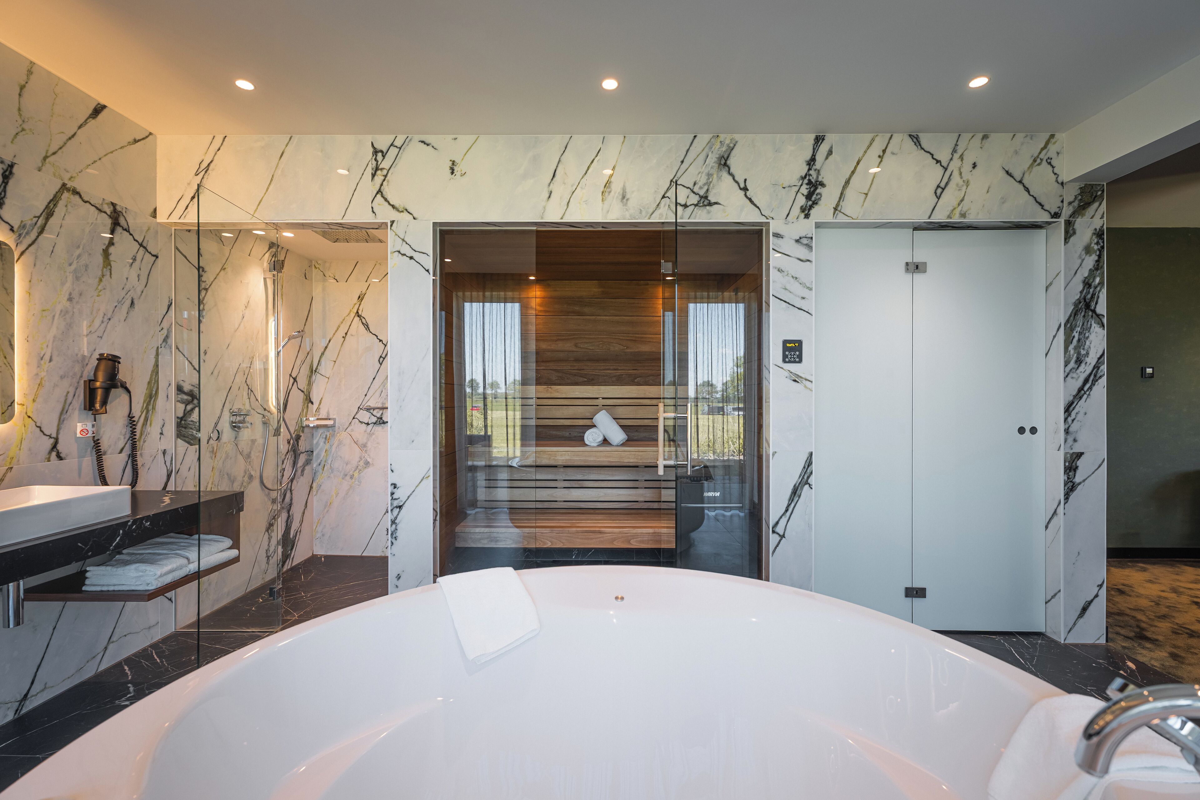 signature suite | bathroom | separate bathtub and shower, free toiletries, hair dryer, towels