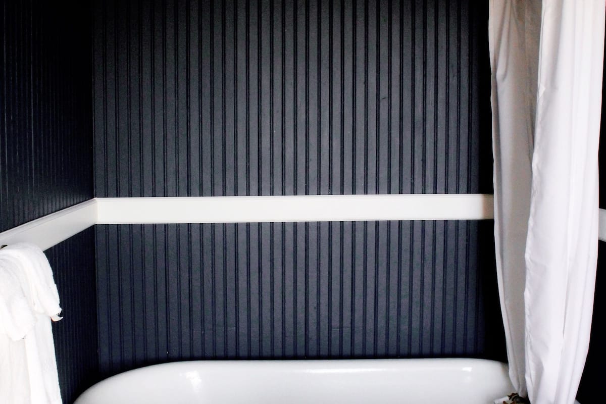 deluxe room, 1 queen bed | bathroom | hair dryer, bathrobes, towels, soap