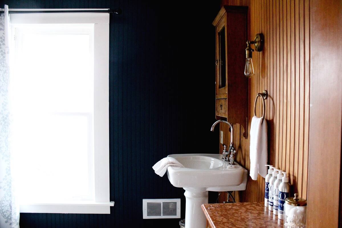 deluxe room, 1 king bed | bathroom | hair dryer, bathrobes, towels, soap