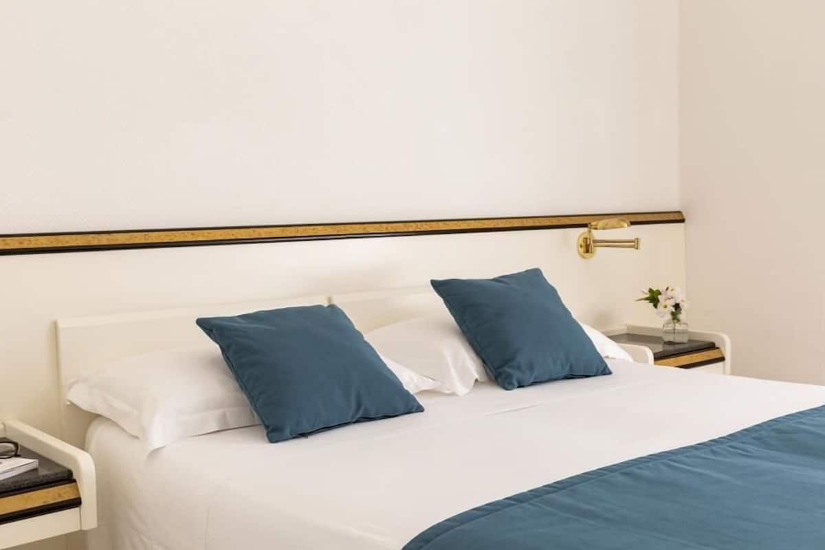 Minibar, desk, blackout drapes, bed sheets