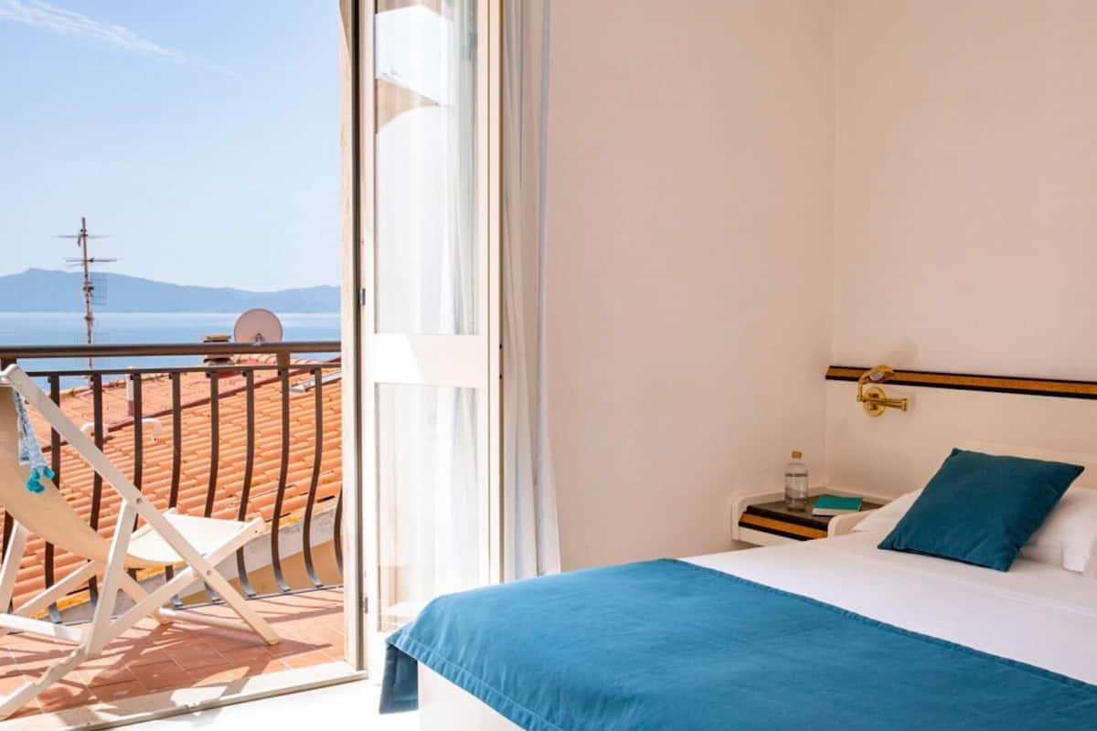 Comfort Double or Twin Room | Minibar, desk, blackout drapes, bed sheets