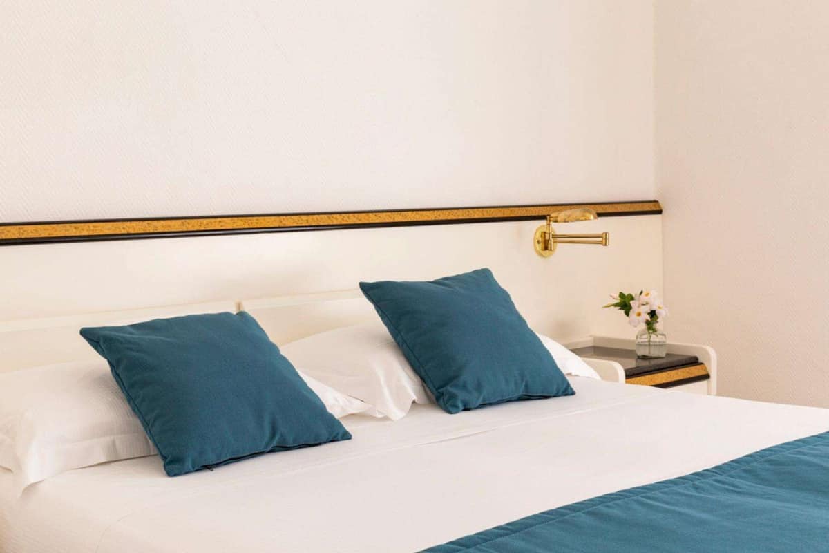 Minibar, desk, blackout curtains, bed sheets